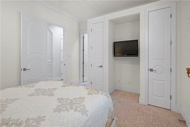 10371 Via Anacapri Ct, Miromar Lakes, FL 33913 - bedroom with light colored carpet, ornamental molding, and baseboards