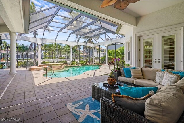 10371 Via Anacapri Ct, Miromar Lakes, FL 33913 - outdoor pool with a patio area, french doors, an outdoor living space, a ceiling fan, and an in ground hot tub
