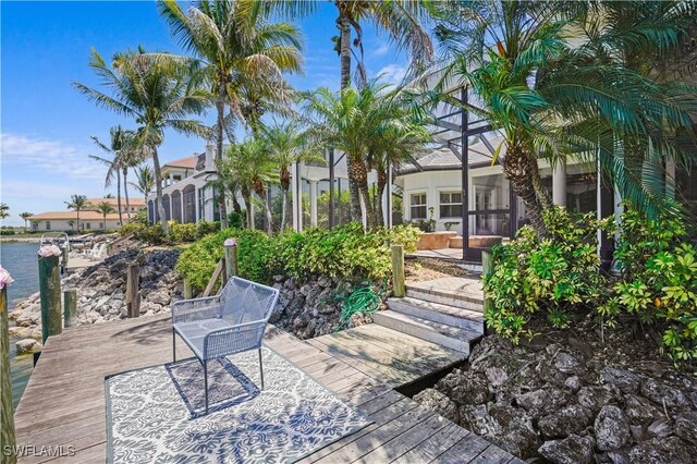 10371 Via Anacapri Ct, Miromar Lakes, FL 33913 - view of patio / terrace with a deck and glass enclosure
