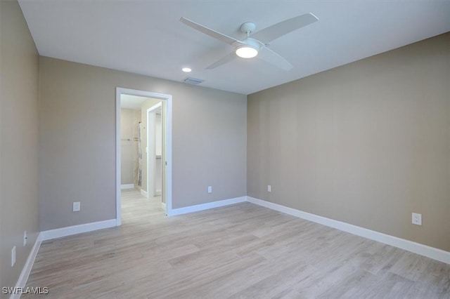 spare room featuring visible vents, light wood-style floors, baseboards, ceiling fan, and recessed lighting