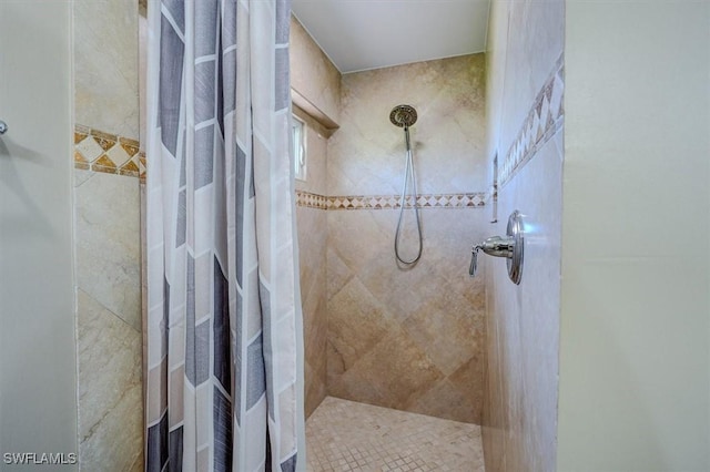 full bathroom with a tile shower
