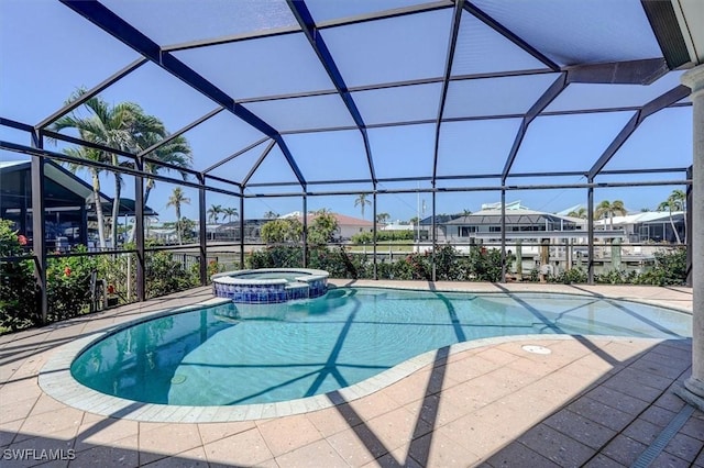 view of swimming pool with glass enclosure and a pool with connected hot tub