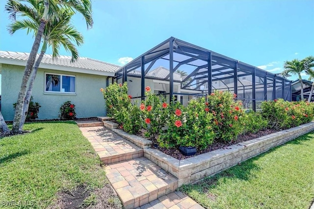 view of yard with glass enclosure