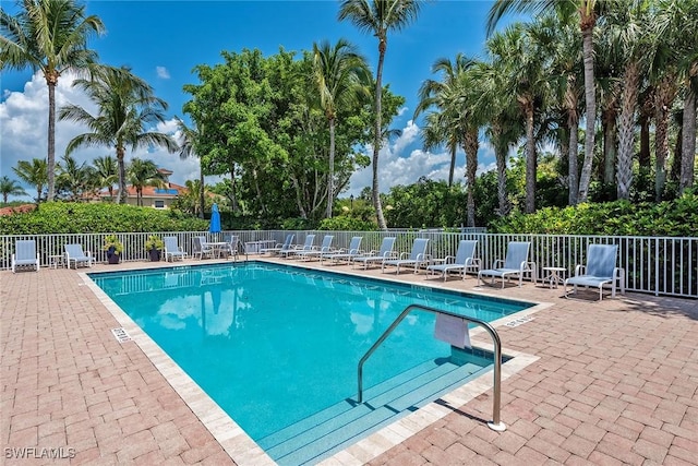 pool featuring a patio and fence
