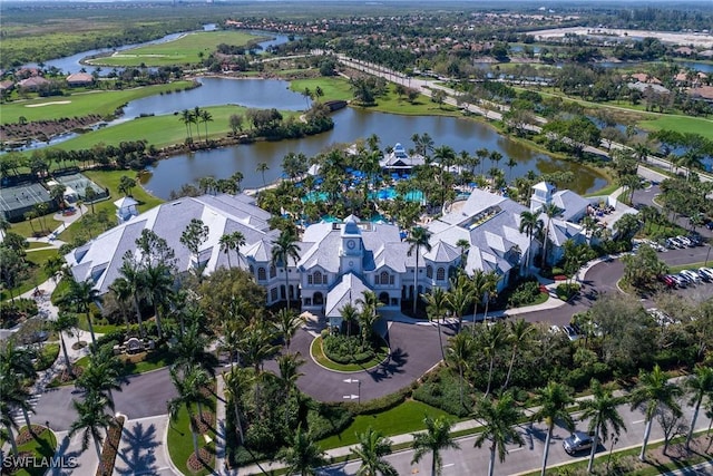 birds eye view of property with a water view, view of golf course, and a residential view
