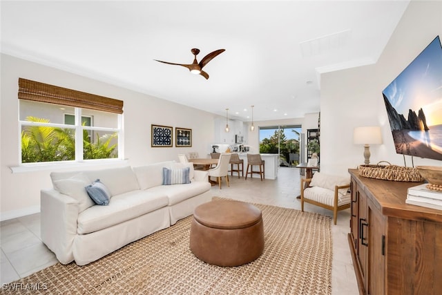28306 Captiva Shell Loop, Bonita Springs, FL 34135 - living area featuring baseboards, ceiling fan, and light tile patterned floors