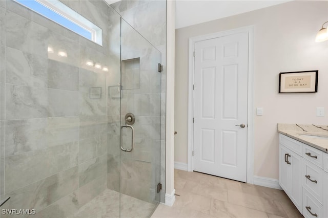 28306 Captiva Shell Loop, Bonita Springs, FL 34135 - bathroom featuring vanity, baseboards, and a stall shower