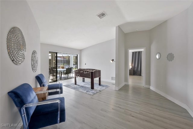 2723 SW 5th Ave, Cape Coral, FL 33914 - recreation room featuring wood finished floors and baseboards