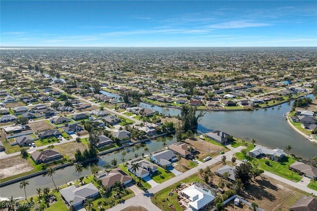 2723 SW 5th Ave, Cape Coral, FL 33914 - aerial view of property and surrounding area featuring nearby suburban area and a nearby body of water