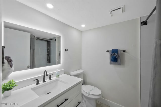 2723 SW 5th Ave, Cape Coral, FL 33914 - bathroom featuring a stall shower, toilet, vanity, and recessed lighting