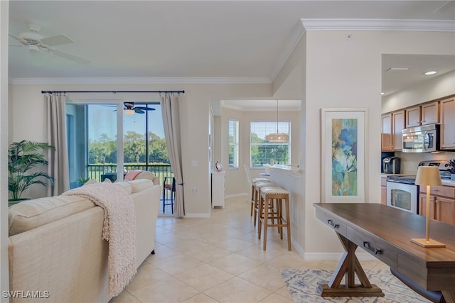 living room with crown molding, baseboards, ceiling fan, and light tile patterned flooring