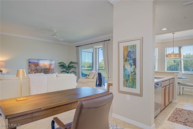 office space featuring crown molding, a ceiling fan, baseboards, and light tile patterned floors