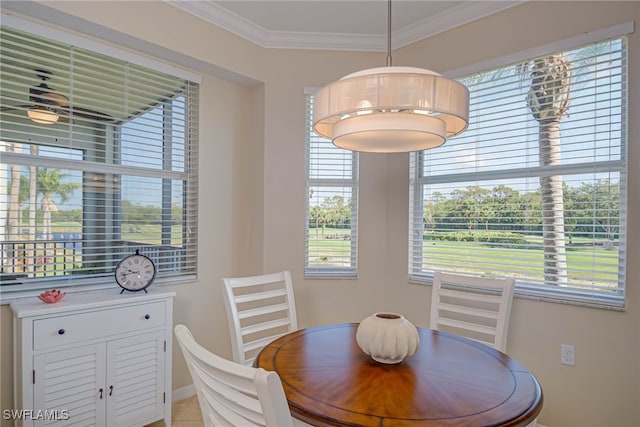 dining area featuring baseboards and ornamental molding