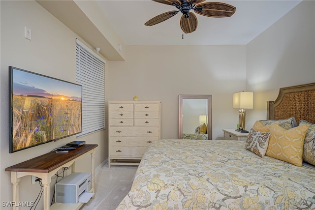 carpeted bedroom with baseboards and a ceiling fan