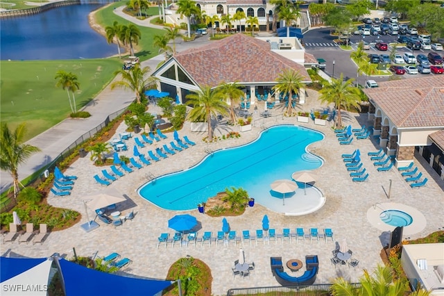 view of swimming pool with a water view