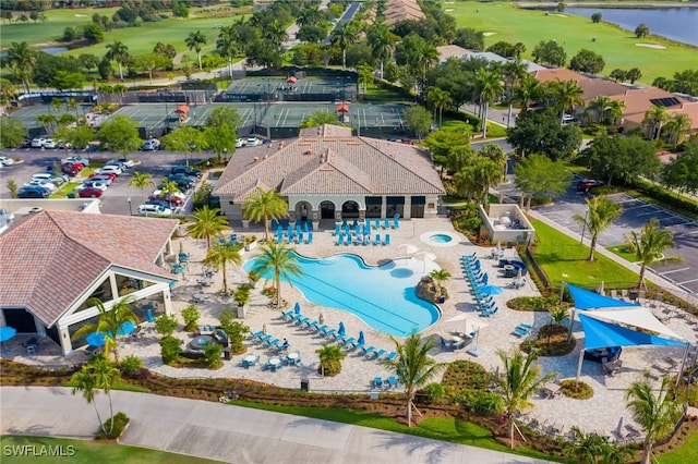 aerial view with a water view and golf course view
