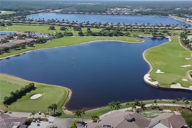 drone / aerial view with a water view, golf course view, and a residential view