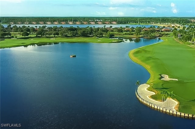 aerial view with a water view and view of golf course