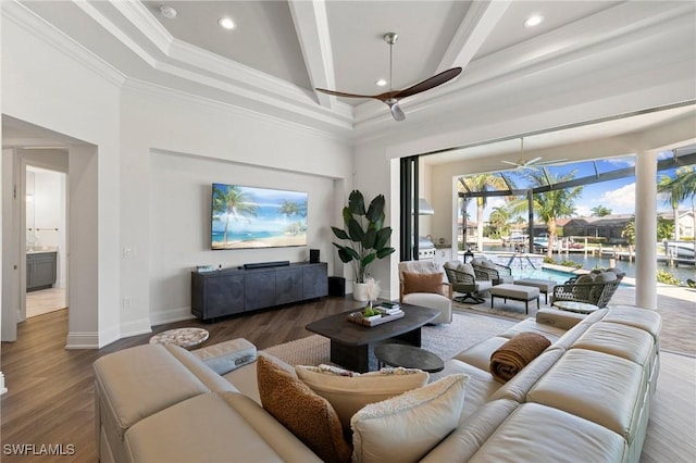 living area featuring recessed lighting, a ceiling fan, wood finished floors, and beamed ceiling