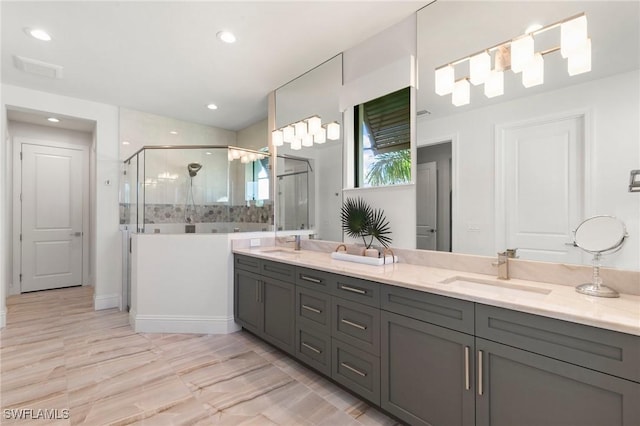full bathroom featuring double vanity, a sink, recessed lighting, and a shower stall