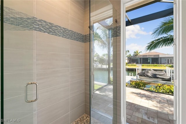 bathroom with a water view and a stall shower