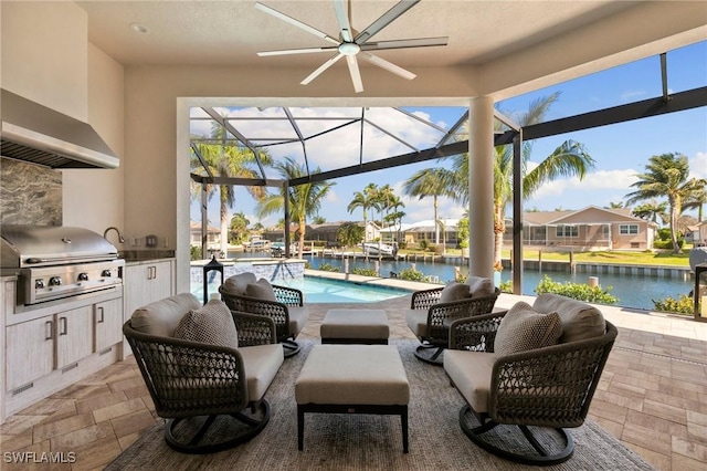 view of patio / terrace featuring ceiling fan, area for grilling, an outdoor pool, a water view, and a grill