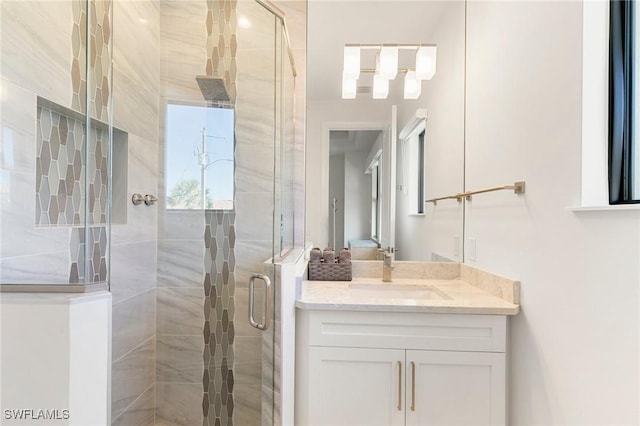 full bathroom with vanity and a stall shower