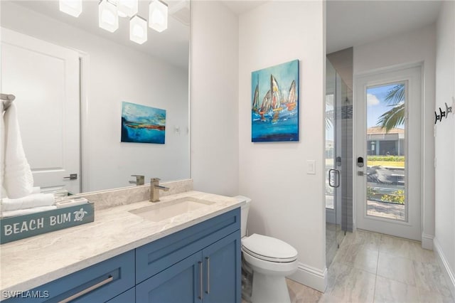 full bathroom with vanity, marble finish floor, toilet, baseboards, and a stall shower