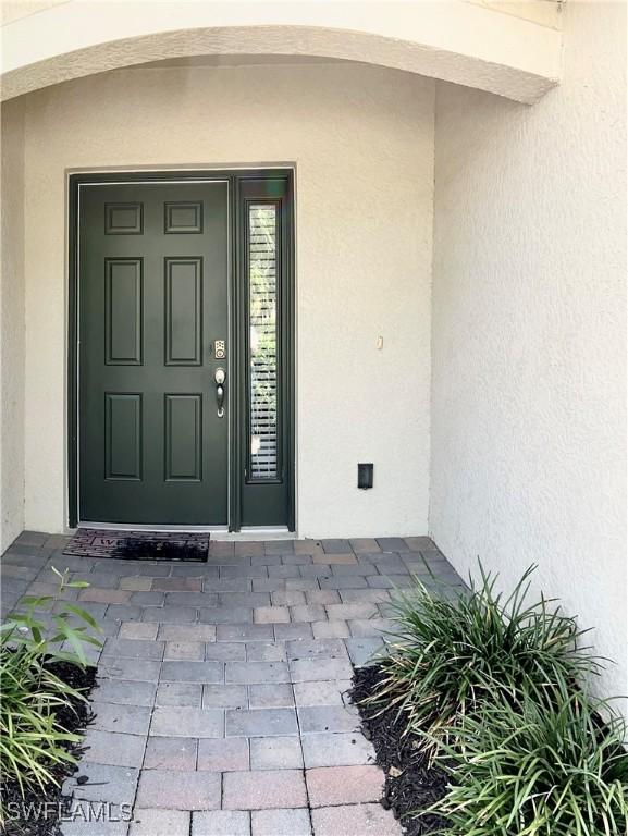 3779 Crofton Ct, Fort Myers, FL 33916 - entrance to property with stucco siding