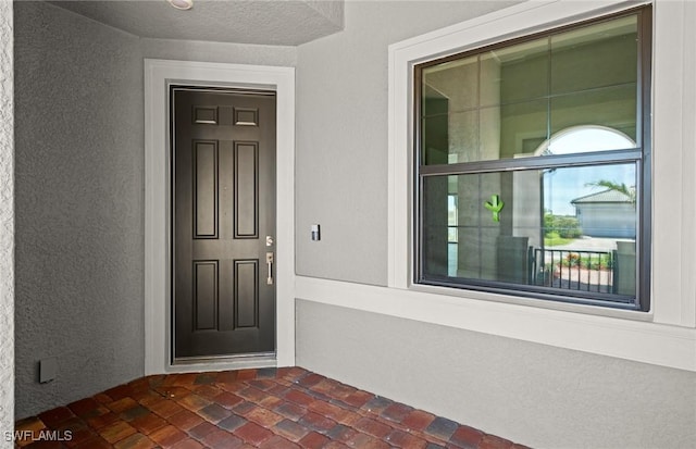 16748 Rolling Rock Blvd, Alva, FL 33920 - doorway to property with stucco siding