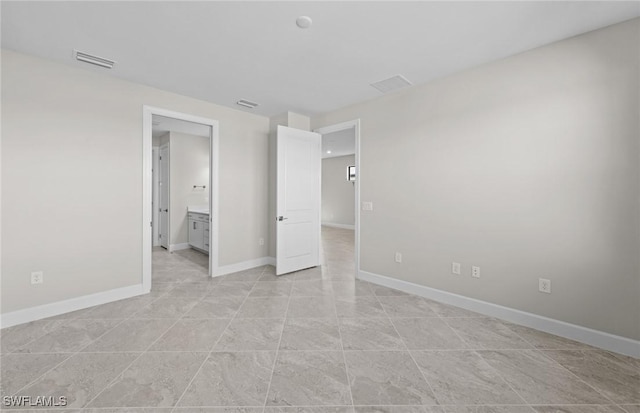 16748 Rolling Rock Blvd, Alva, FL 33920 - unfurnished bedroom featuring baseboards and ensuite bathroom