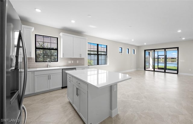 16748 Rolling Rock Blvd, Alva, FL 33920 - kitchen featuring stainless steel appliances, a sink, healthy amount of natural light, backsplash, and recessed lighting