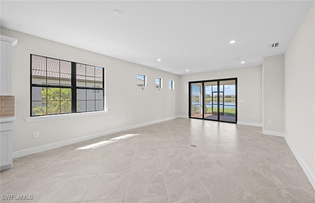 16748 Rolling Rock Blvd, Alva, FL 33920 - unfurnished living room with baseboards, recessed lighting, and light tile patterned floors