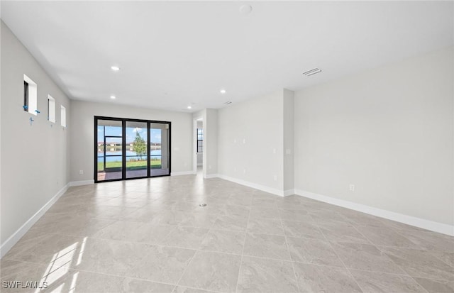 16748 Rolling Rock Blvd, Alva, FL 33920 - unfurnished room featuring recessed lighting, baseboards, and light tile patterned flooring