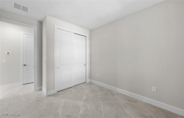 16748 Rolling Rock Blvd, Alva, FL 33920 - unfurnished bedroom with baseboards and a closet