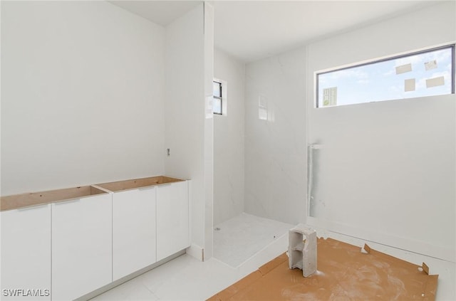 bathroom with a shower stall