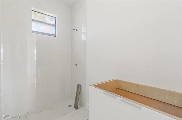 full bath featuring a marble finish shower