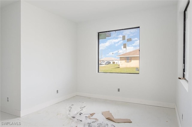 empty room featuring baseboards