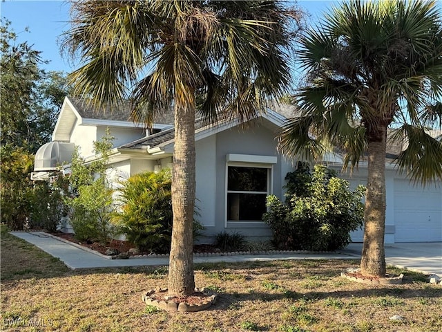 view of property exterior with a garage and stucco siding
