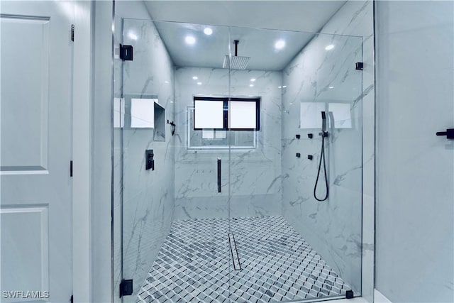bathroom with a marble finish shower