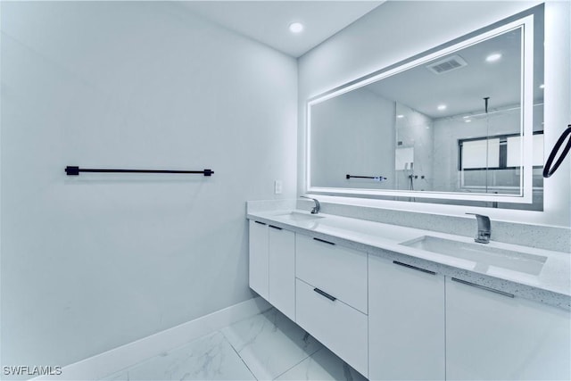 bathroom featuring a sink, a marble finish shower, marble finish floor, baseboards, and visible vents