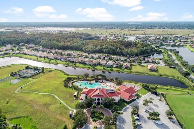 bird's eye view featuring a residential view and a water view