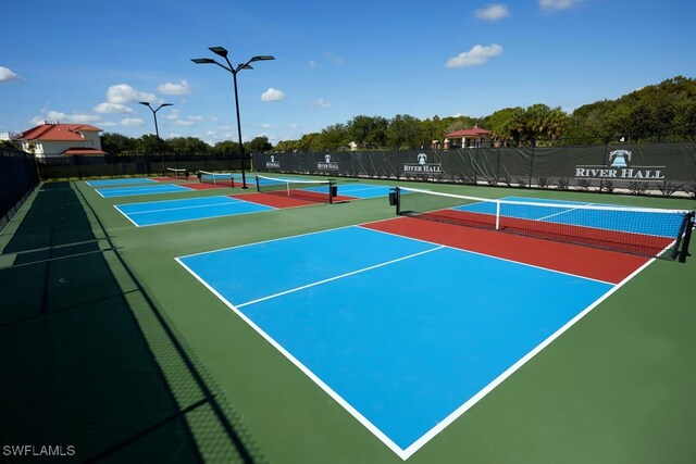 view of sport court featuring community basketball court and fence