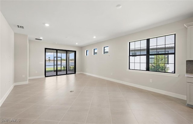 16740 Rolling Rock Blvd, Alva, FL 33920 - unfurnished room featuring baseboards, light tile patterned flooring, and recessed lighting