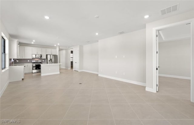 16740 Rolling Rock Blvd, Alva, FL 33920 - unfurnished living room with recessed lighting, a sink, baseboards, and light tile patterned floors