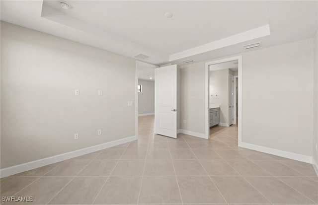 16740 Rolling Rock Blvd, Alva, FL 33920 - unfurnished bedroom with baseboards, ensuite bathroom, and light tile patterned flooring