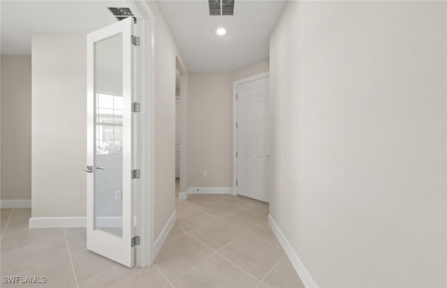 16740 Rolling Rock Blvd, Alva, FL 33920 - hall featuring light tile patterned floors, baseboards, and recessed lighting