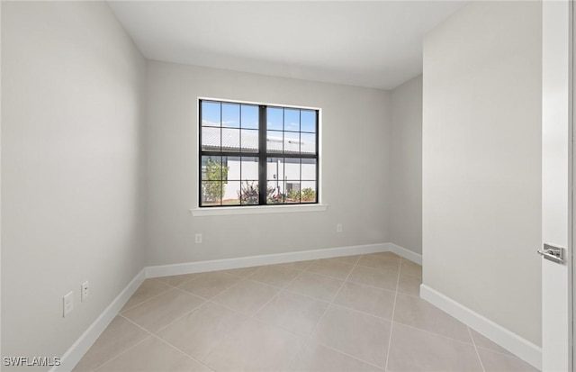 16740 Rolling Rock Blvd, Alva, FL 33920 - empty room with light tile patterned floors and baseboards
