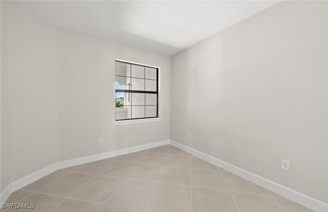 16740 Rolling Rock Blvd, Alva, FL 33920 - unfurnished room with baseboards and light tile patterned flooring