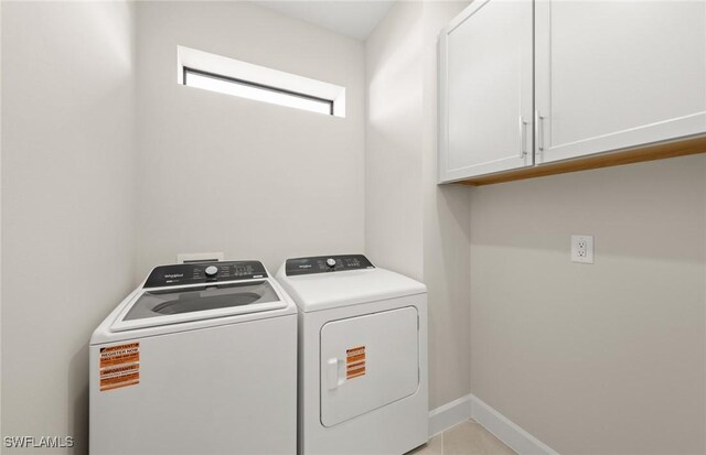 16740 Rolling Rock Blvd, Alva, FL 33920 - washroom with cabinet space, washing machine and dryer, and baseboards